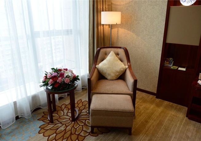 Imagen de la habitación del Hotel New Century Yiwu. Foto 14
