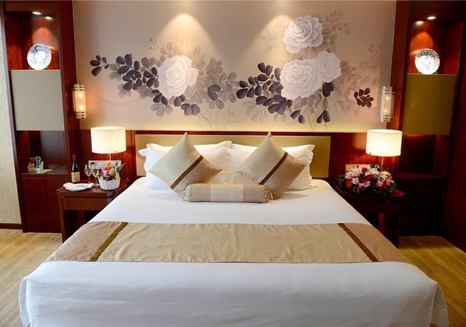 Imagen de la habitación del Hotel New Century Yiwu. Foto 15
