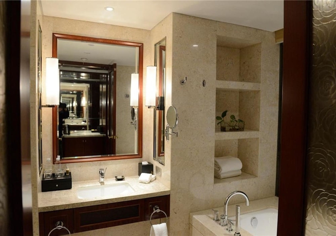 Imagen de la habitación del Hotel New Century Yiwu. Foto 16
