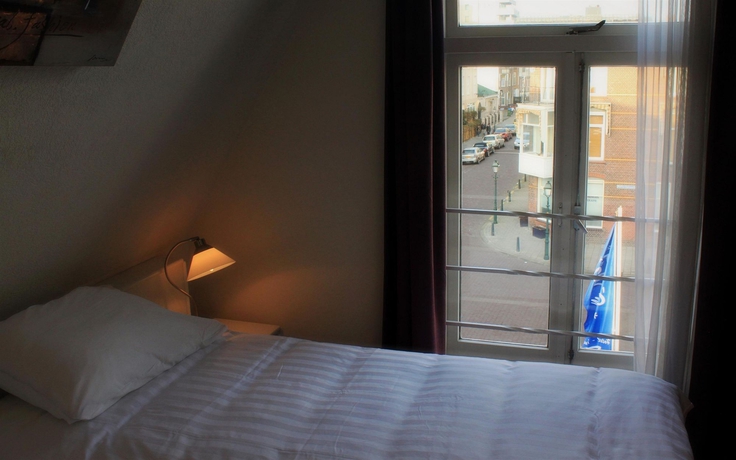 Imagen de la habitación del Hotel New City Scheveningen. Foto 8