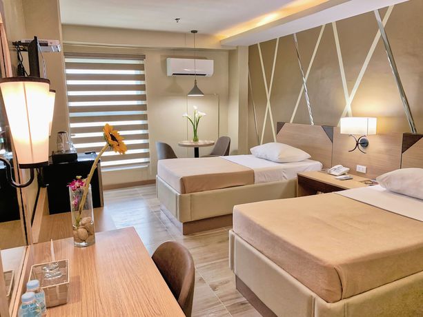 Imagen de la habitación del Hotel New Dawn Plus. Foto 8