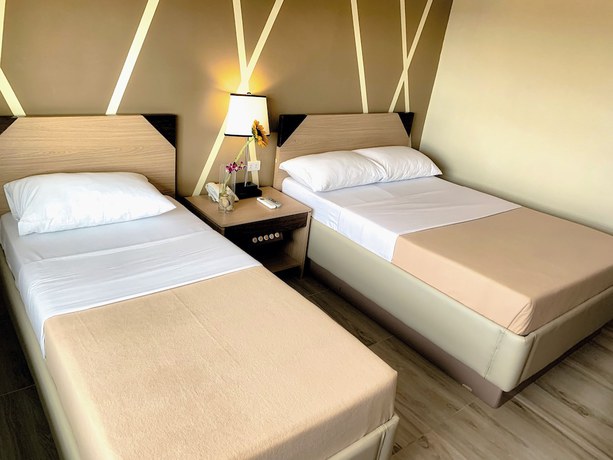 Imagen de la habitación del Hotel New Dawn Plus. Foto 9