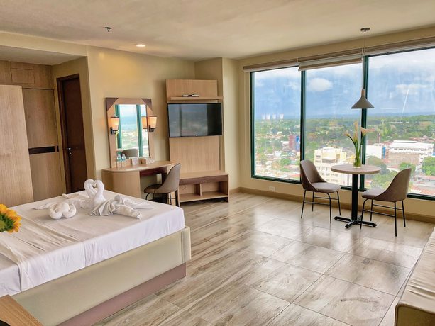 Imagen de la habitación del Hotel New Dawn Plus. Foto 10