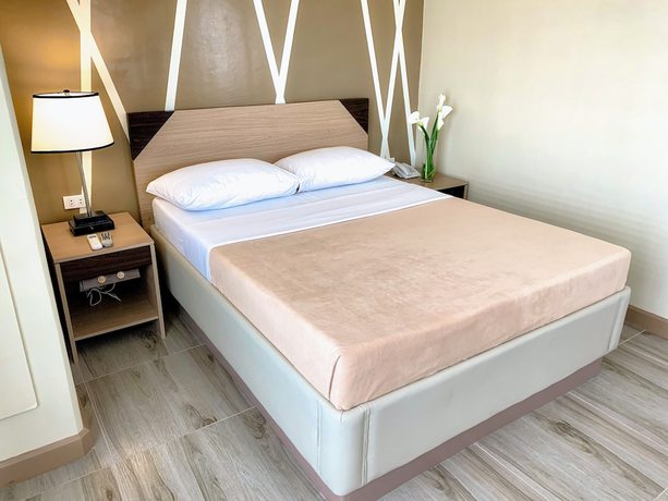 Imagen de la habitación del Hotel New Dawn Plus. Foto 11
