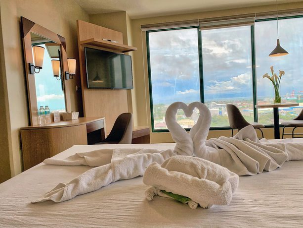 Imagen de la habitación del Hotel New Dawn Plus. Foto 12