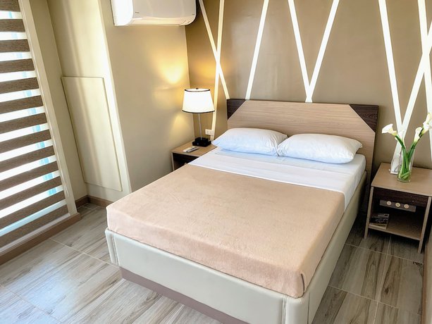 Imagen de la habitación del Hotel New Dawn Plus. Foto 13