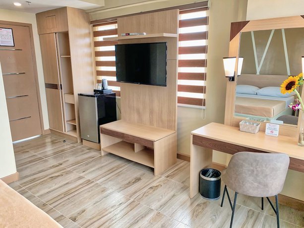 Imagen de la habitación del Hotel New Dawn Plus. Foto 14