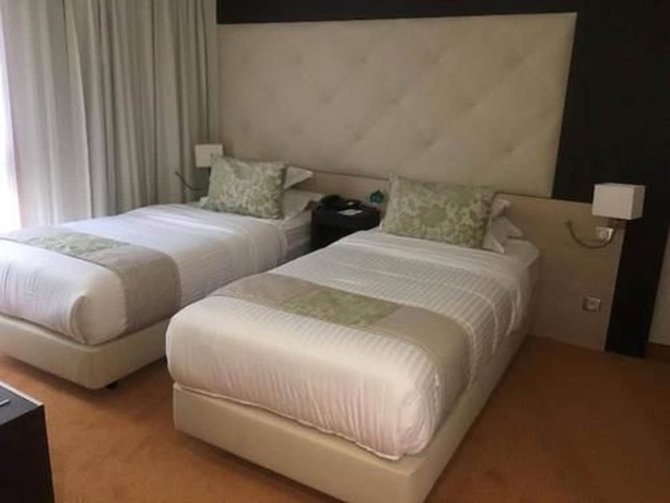 Imagen de la habitación del Hotel New Day. Foto 14