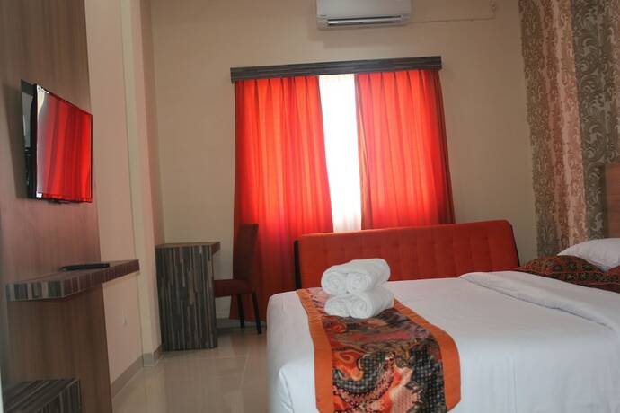 Imagen de la habitación del Hotel New D'dhave. Foto 19