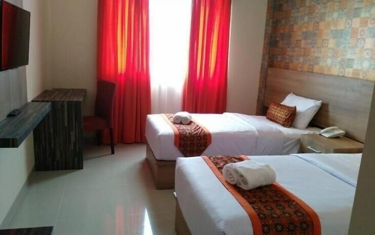 Imagen de la habitación del Hotel New D'dhave. Foto 23