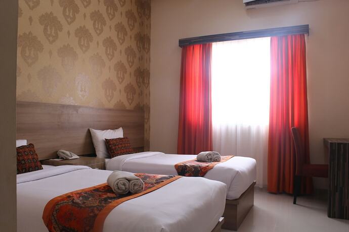 Imagen de la habitación del Hotel New D'dhave. Foto 24