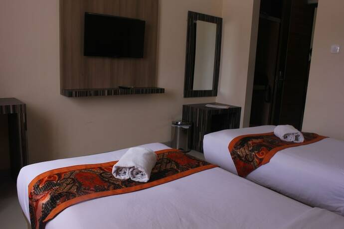 Imagen de la habitación del Hotel New D'dhave. Foto 26