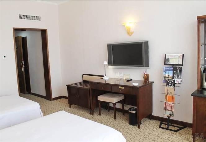 Imagen de la habitación del Hotel New Era Hotel. Foto 8