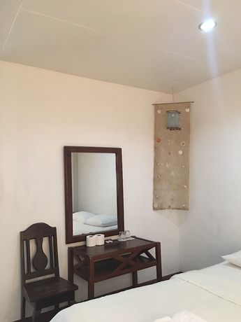 Imagen de la habitación del Hotel New Eve's Kiosk Dive Resort. Foto 8