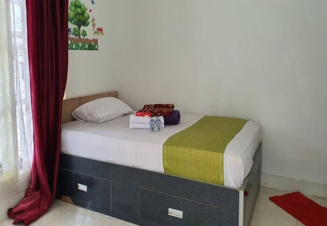 Imagen de la habitación del Hotel New Fatimah Guest House Syariah. Foto 2