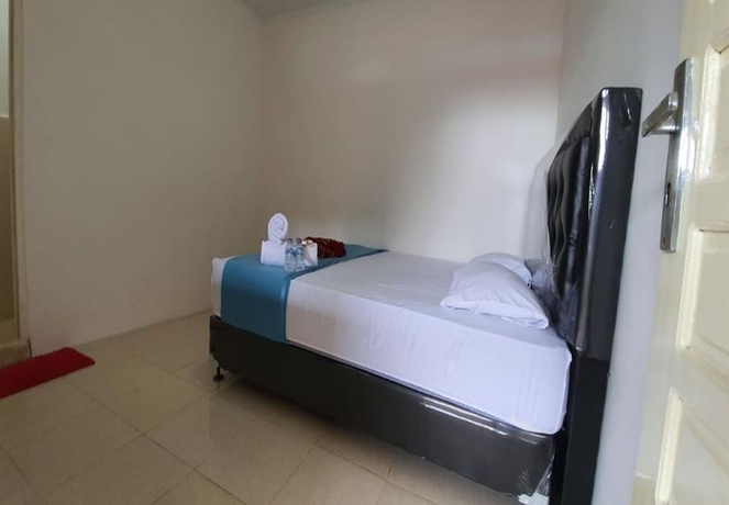 Imagen de la habitación del Hotel New Fatimah Guest House Syariah. Foto 3