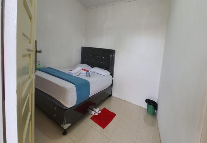 Imagen de la habitación del Hotel New Fatimah Guest House Syariah. Foto 4