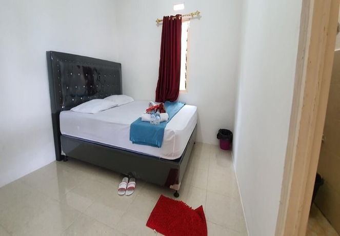 Imagen de la habitación del Hotel New Fatimah Guest House Syariah. Foto 6