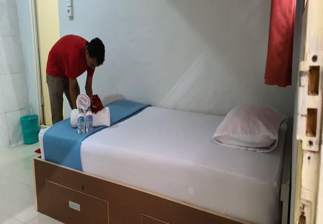 Imagen de la habitación del Hotel New Fatimah Guest House Syariah. Foto 7