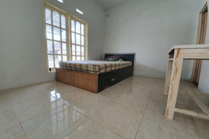 Imagen de la habitación del Hotel New Fatimah Guest House Syariah. Foto 9