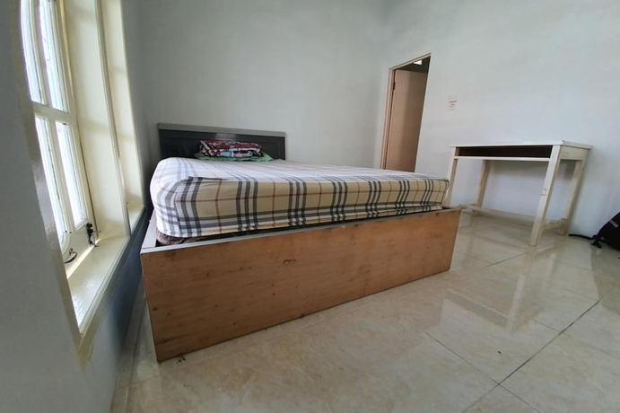 Imagen de la habitación del Hotel New Fatimah Guest House Syariah. Foto 10