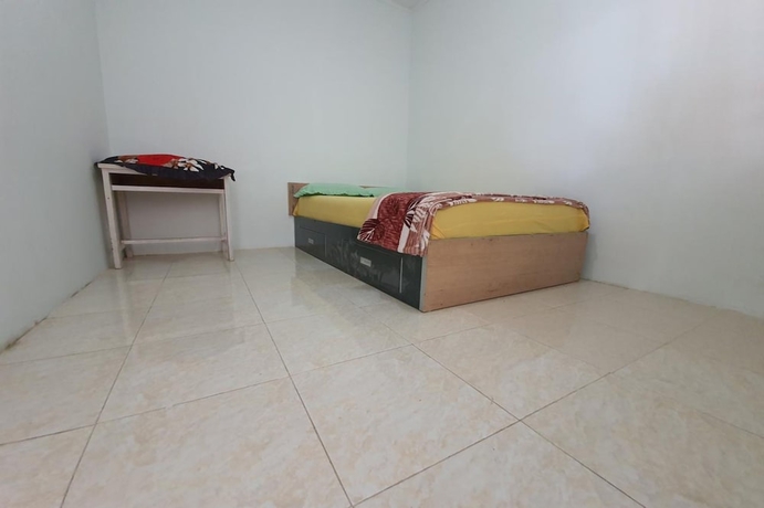 Imagen de la habitación del Hotel New Fatimah Guest House Syariah. Foto 13