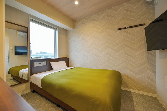 Imagen de la habitación del Hotel New Gaea Hakata Messeminami. Foto 8