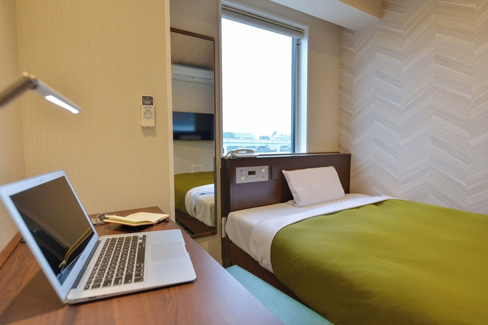 Imagen de la habitación del Hotel New Gaea Hakata Messeminami. Foto 9