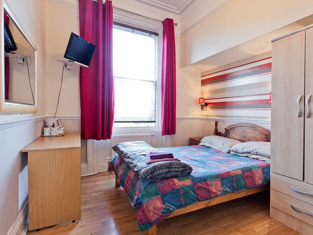 Imagen de la habitación del Hotel New George. Foto 15