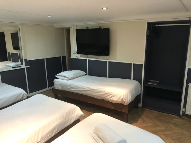 Imagen de la habitación del Hotel New George. Foto 16