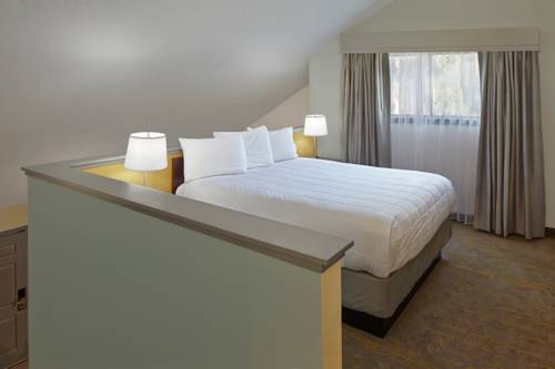 Imagen de la habitación del Hotel New Haven Village Suites. Foto 3