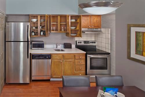 Imagen de la habitación del Hotel New Haven Village Suites. Foto 6