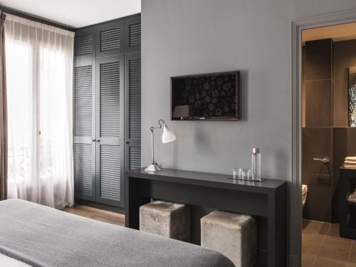 Imagen de la habitación del Hotel New Hotel Roblin La Madeleine. Foto 15