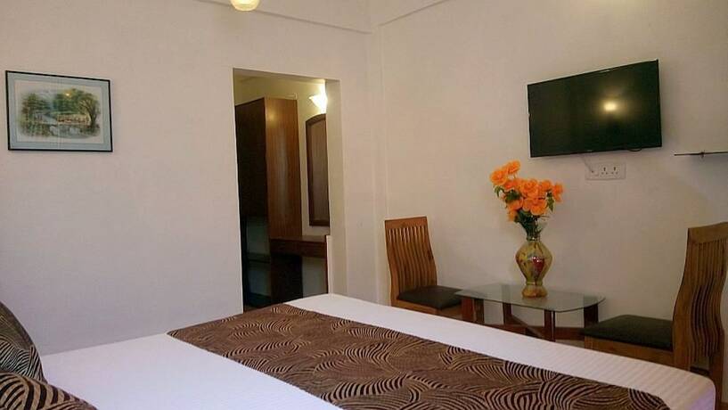 Imagen de la habitación del Hotel New Image Inn. Foto 15