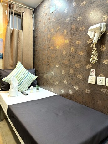 Imagen de la habitación del Hotel New International Guest House, Kowloon. Foto 5