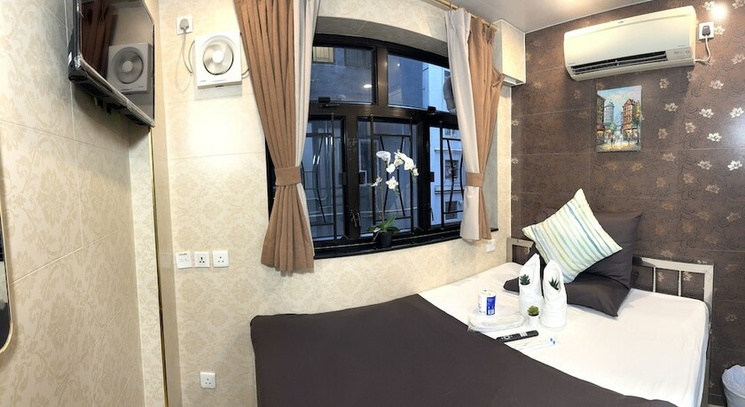 Imagen de la habitación del Hotel New International Guest House, Kowloon. Foto 11