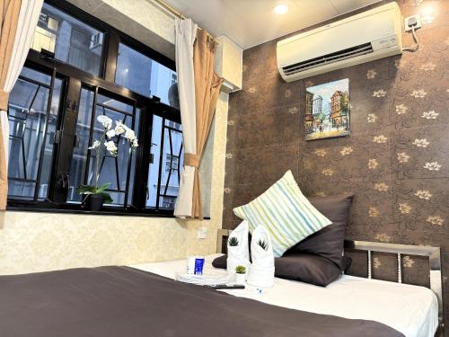 Imagen de la habitación del Hotel New International Guest House, Kowloon. Foto 11