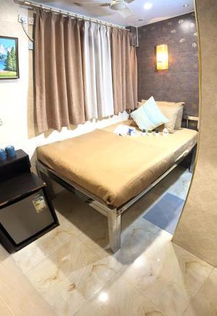 Imagen de la habitación del Hotel New International Guest House, Kowloon. Foto 15