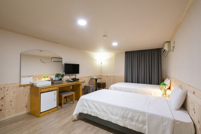 Imagen de la habitación del Hotel New Jeju. Foto 17