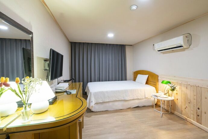 Imagen de la habitación del Hotel New Jeju. Foto 19