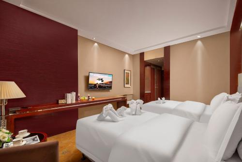 Imagen de la habitación del Hotel New Jiuzhai. Foto 17