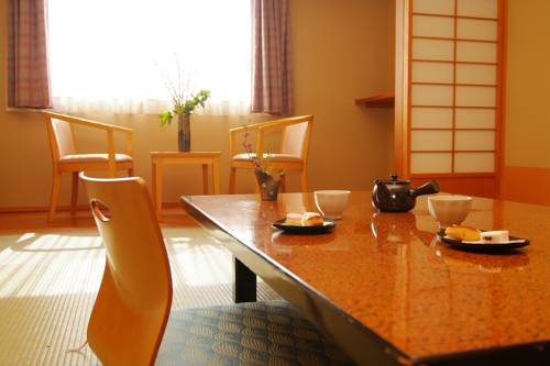 Imagen de la habitación del Hotel New Kanei. Foto 2