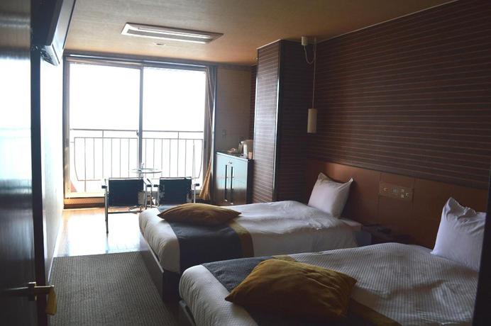 Imagen de la habitación del Hotel New Kankai Honkan Tenku Hotel Kairo. Foto 10