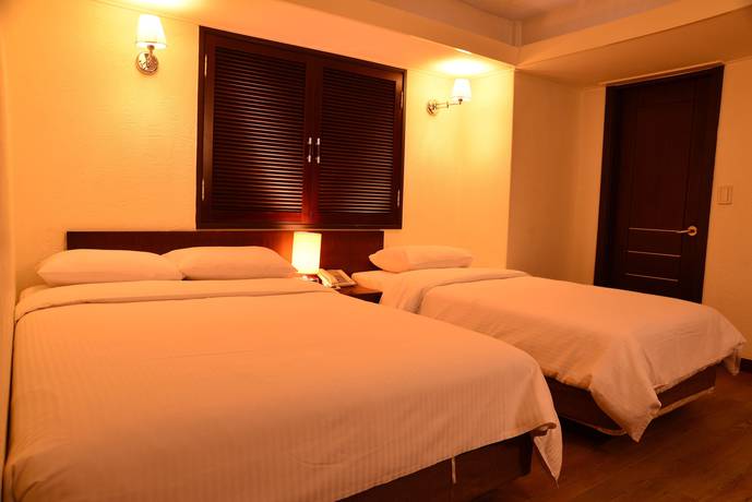 Imagen de la habitación del Hotel New Korea. Foto 16