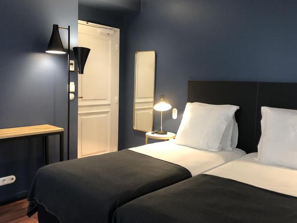 Imagen de la habitación del Hotel New Le Voltaire. Foto 5