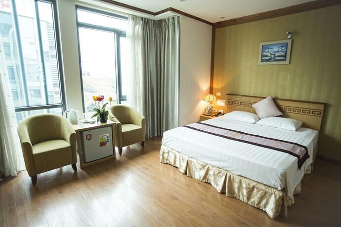 Imagen de la habitación del Hotel New Lotus. Foto 25