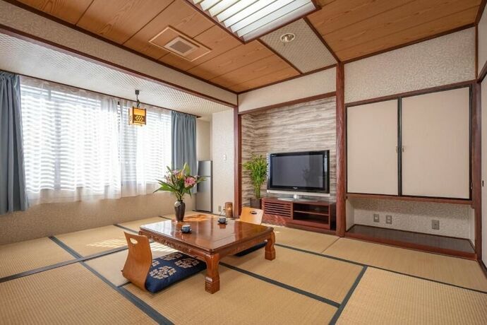 Imagen de la habitación del Hotel New Makomo. Foto 18