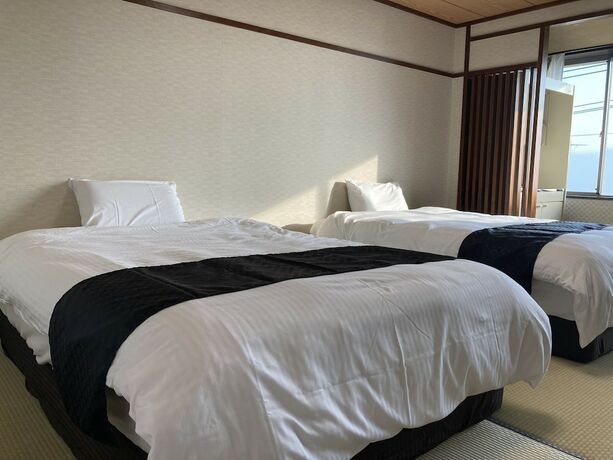 Imagen de la habitación del Hotel New Makomo. Foto 19