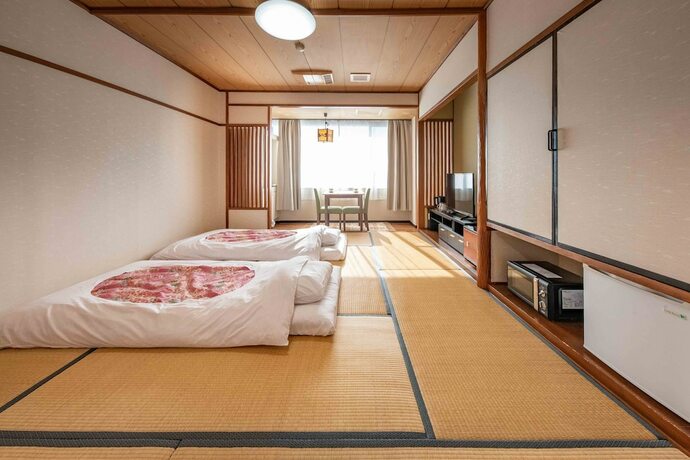 Imagen de la habitación del Hotel New Makomo. Foto 36