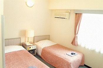 Imagen de la habitación del Hotel New Marukatsu. Foto 7